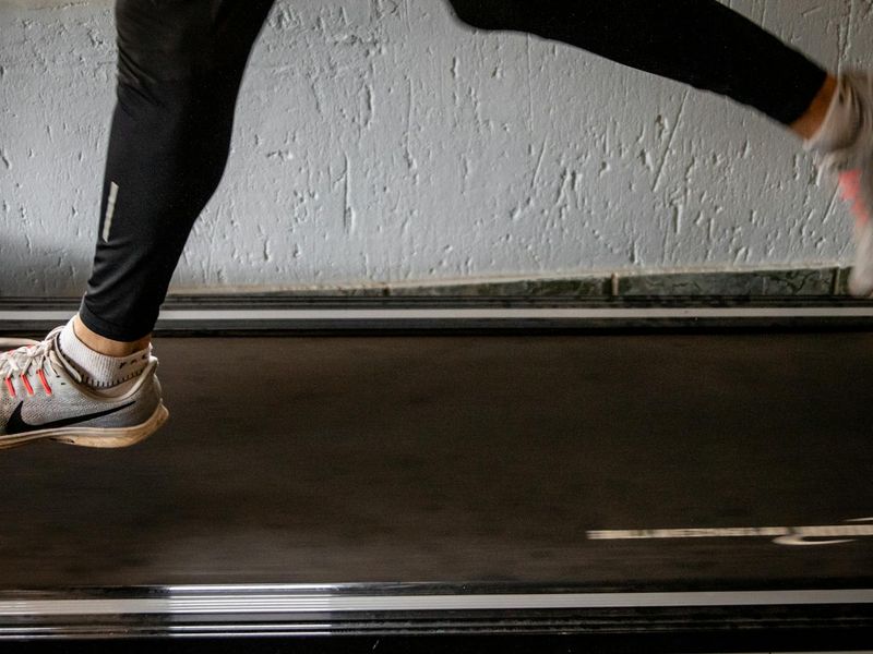 Blurred motion of an athlete running on a treadmill